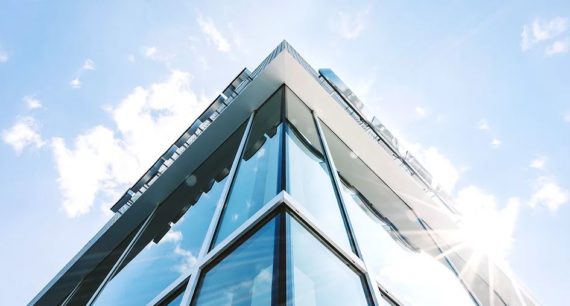 Looking up at a Glass Building